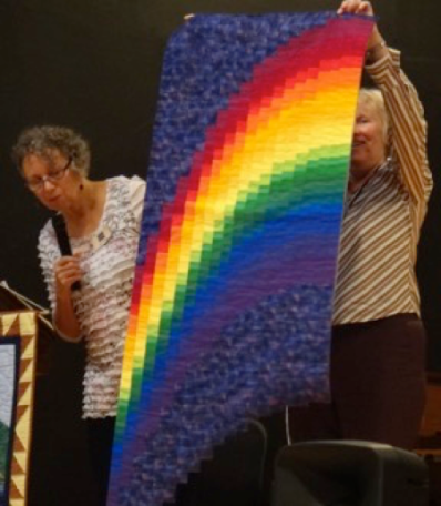 One of many rainbow and colour theory quilts - Judy used the pillow method of backing to allow for the uneven edges at the bottom, and a hammer to flatten the seams